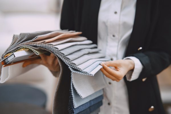 woman-customer-looking-beautiful-fabric-drapery-shop woman-customer-looking-beautiful-fabric-drapery-shop